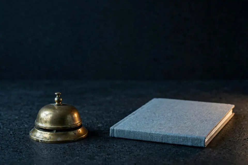 Brass counter bell and notebook